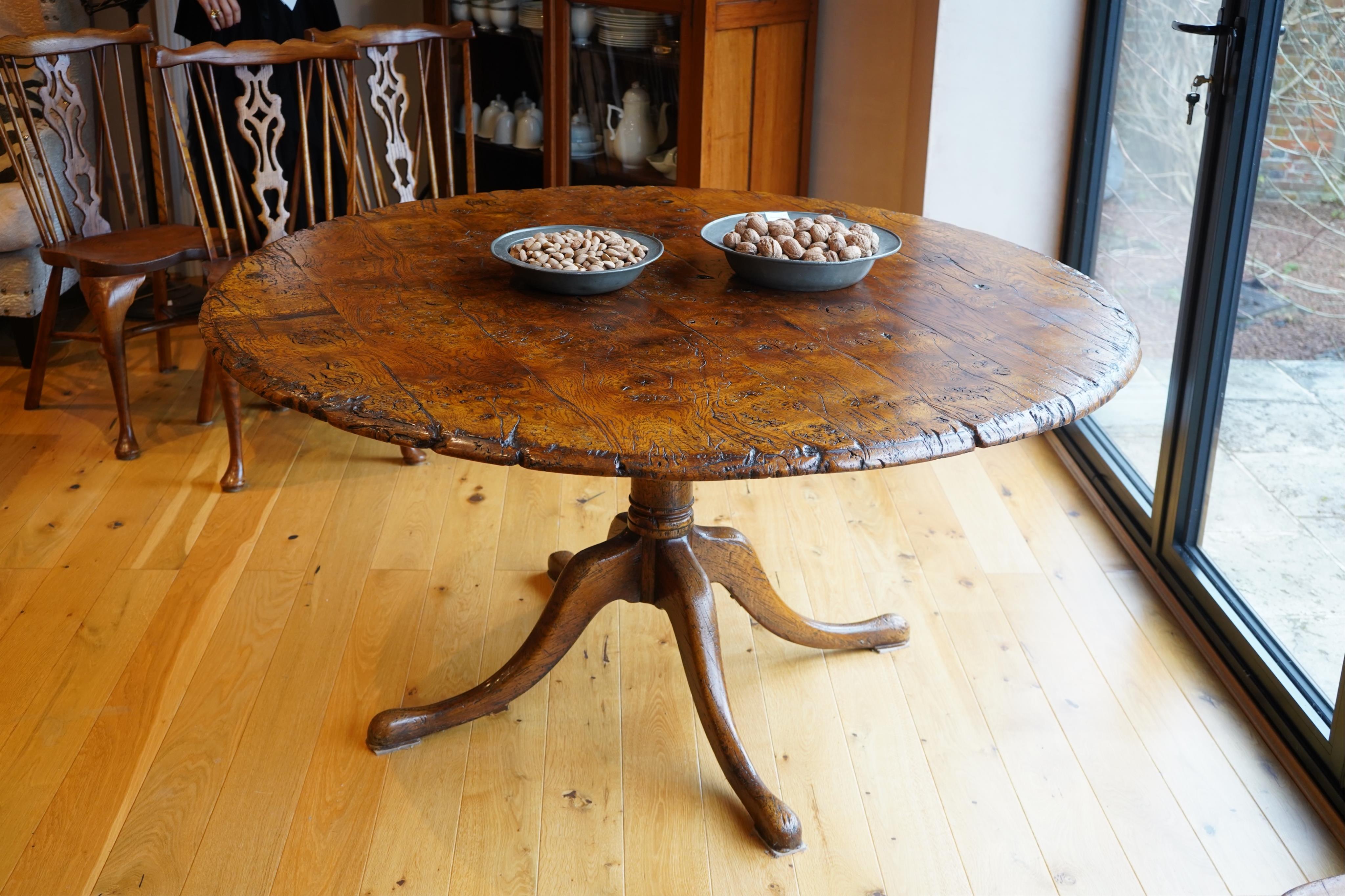 Titchmarsh & Goodwin, a circular burr elm dining table, diameter 150cm, height 77cm. Condition - good